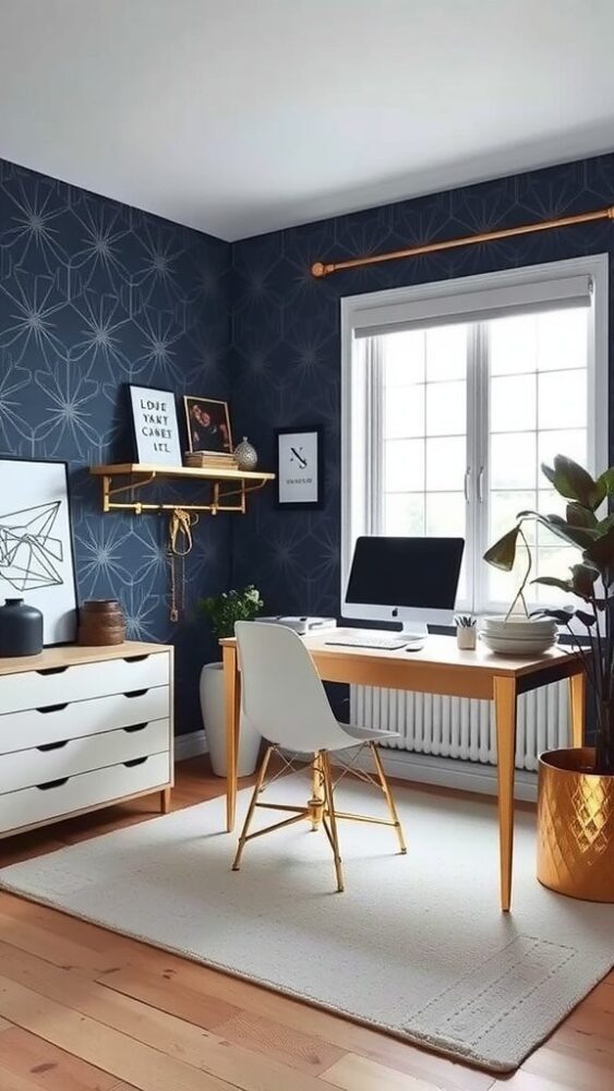 A home office featuring bold navy wallpaper, a wooden desk, gold accents, and a bright window.