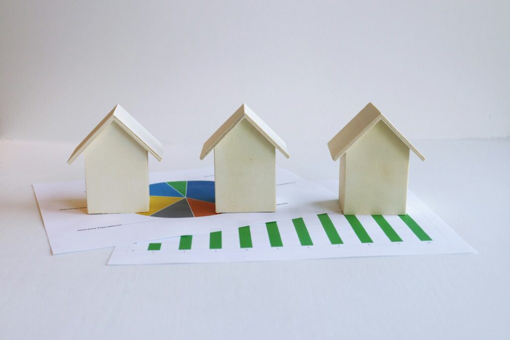 3 Ways to Get Your Home Office Mortgage 1 three small houses sitting on top of a piece of paper